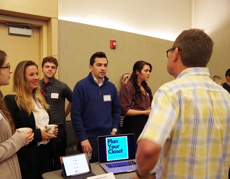 A team of students answering questions from a competition judge in a previous Seawolf Pitch Competition at Sonoma State