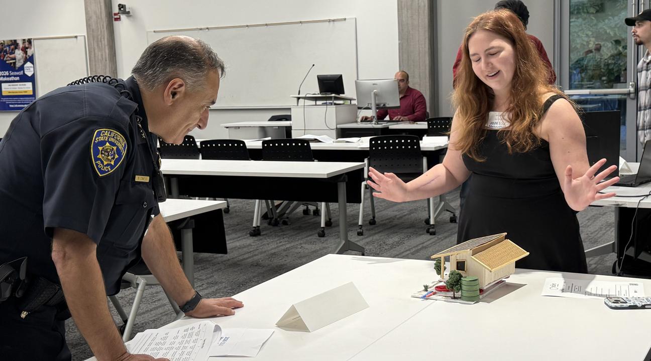 A Student Presents her Project Demo to a Judge During the 2026 Makeathon