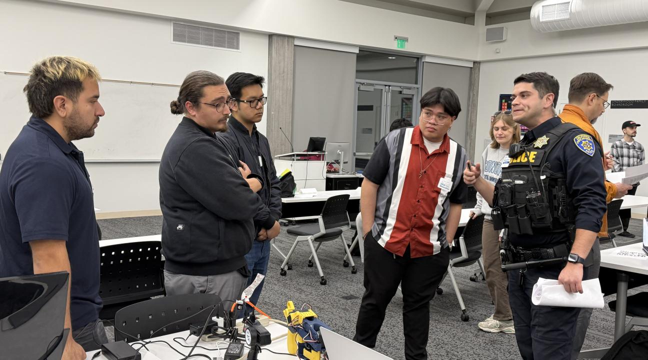 Students Present their Project Demo to a Judge During the 2026 Makeathon