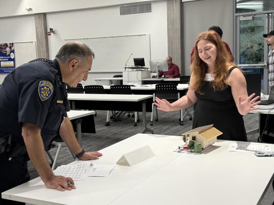 A Student Presents her Project Demo to a Judge During the 2026 Makeathon
