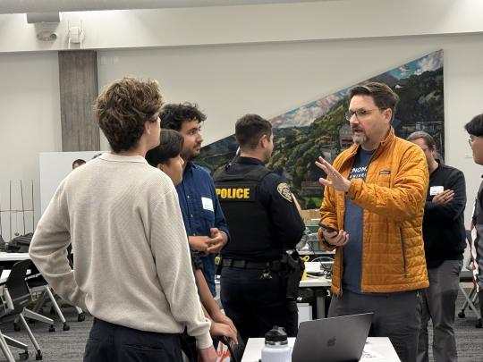Students Present their Project Demo to a Judge During the 2026 Makeathon