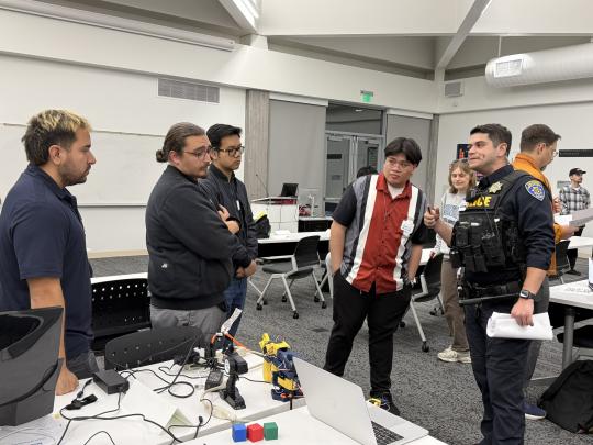Students Present their Project Demo to a Judge During the 2026 Makeathon