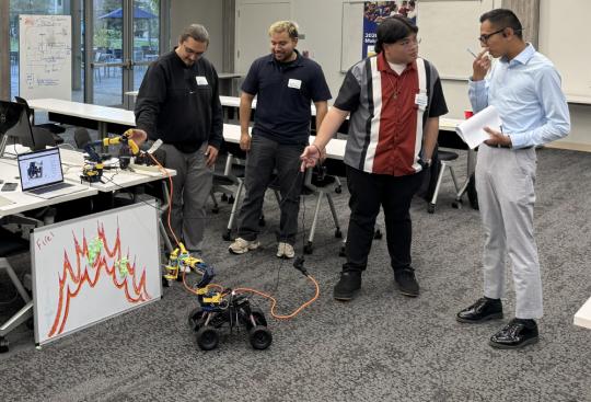 Students Present their Project Demo to a Judge During the 2026 Makeathon
